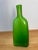 Vivid green hand-blown glass vase with a sculptural, bottle-like form. The bold color and clean silhouette make it a...