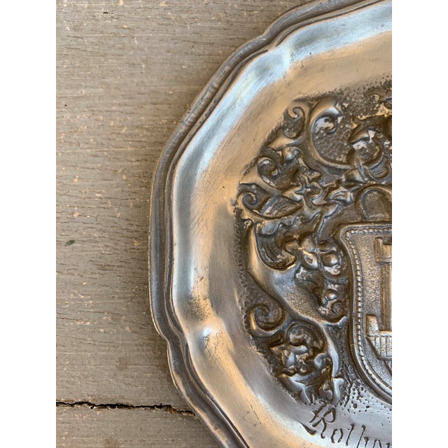 A beautiful pewter wall plate featuring a heraldic coat of arms with a castle and a knight By J. Metten Germany, Mid-20th...