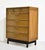 This mid century highboy dresser by American of Martinsville has seven drawers and Chinoiserie-inspired detailing. Three...