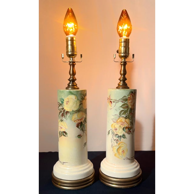 An authentic pair of Hollywood Regency statement lamps by Loevsky & Loevsky (L&L). These ceramic cylinders feature hand-...