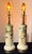 An authentic pair of Hollywood Regency statement lamps by Loevsky & Loevsky (L&L). These ceramic cylinders feature hand-...