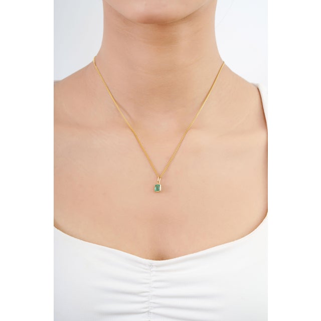 Add a touch of timeless elegance to your jewelry collection with our dainty emerald pendant charm. Featuring a beautiful...