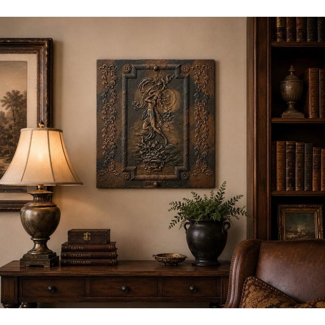 A striking example of early 20th-century Art Nouveau craftsmanship, this exceptional cast iron architectural wall plaque...