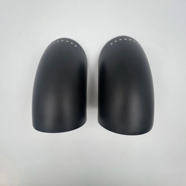 Step back in time with this ultra-rare set of vintage 70s lamps, the ‘gomito,’ designed by elio martinelli in 1974 and...