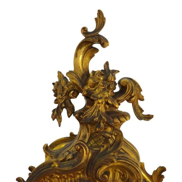 An antique Seth Thomas mantle clock, crafted circa 1900 in the opulent Louis XIV style. This timepiece is a fine example...