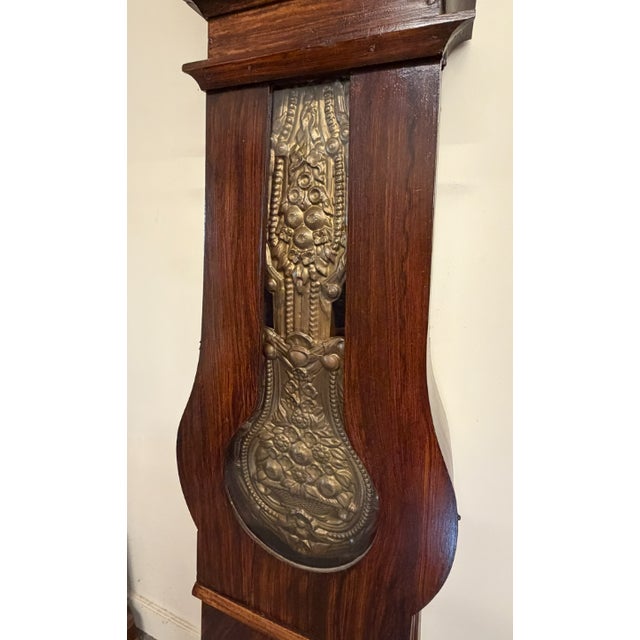 Late 19th Century French, Mobier, Comtoise. Faux Grained, rosewood over pine case. The brass is Repousse - where the...