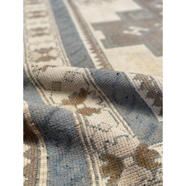 A lovely vintage Oushak rug with blue and beige tones.