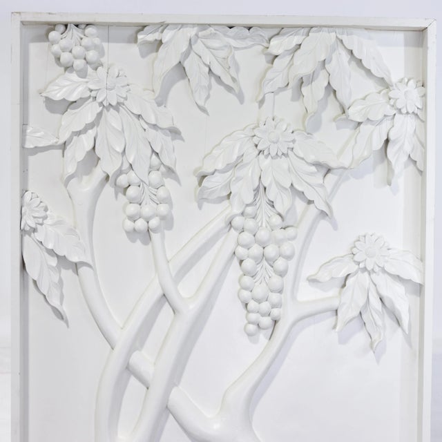 This striking pair of decorative wall panels features deep, sculptural white relief carving in a long, rectangular format....