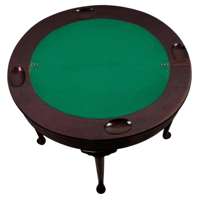 An elegant 18th-century English demi-lune card table, finely crafted from mahogany and distinguished by its graceful...