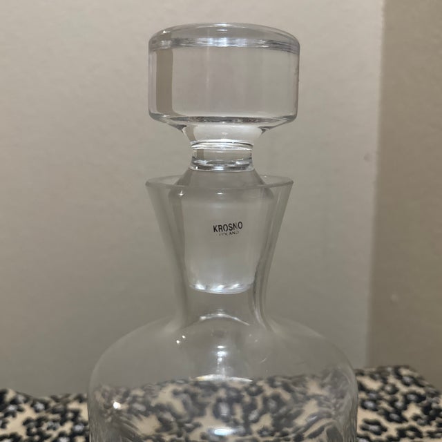 This hand-blown clear glass decanter is a refined example of mid-century European glasswork, characterized by its clean...