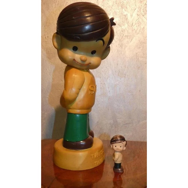 Pair of "Atchan" aka Sony Boy. Figure introduced by Sony in 1956, as a mascot for the launch of the first transistor...