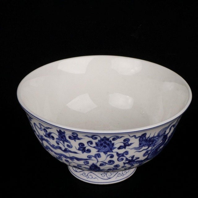 This is a beautiful vintage Chinese porcelain Stem Bowl (高脚碗), elegantly decorated in underglaze blue (Qinghua). The bowl...