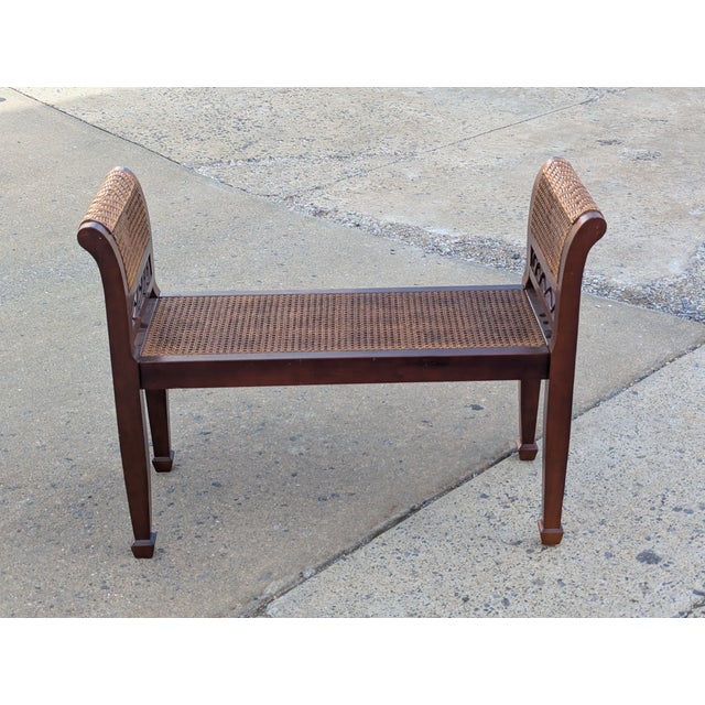 Vintage Empire-style bench made of walnut. Seat and sides made of cane.