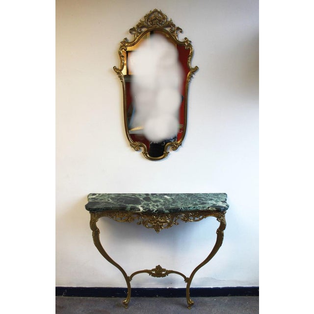 Bronze wall console and mirror.