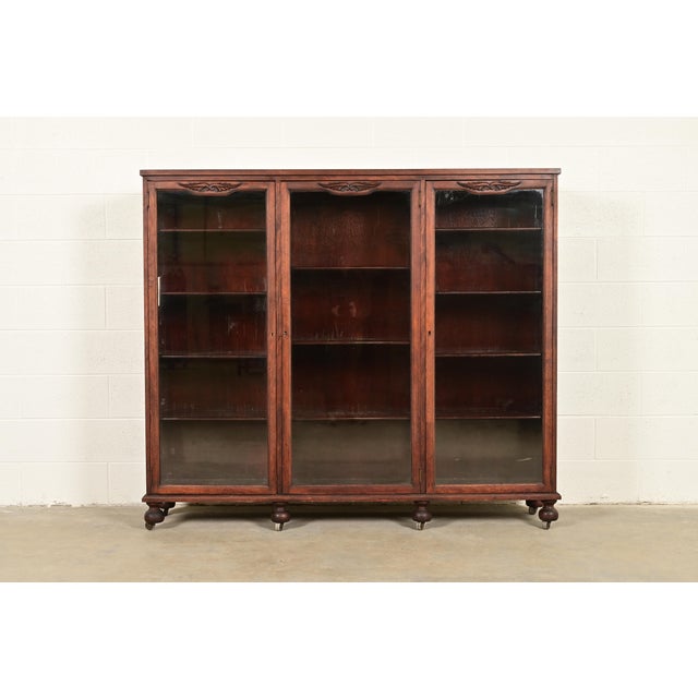 A beautiful antique Victorian, American Empire, or Arts & Crafts triple bookcase or display cabinet By Berkey & Gay USA,...
