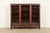 A beautiful antique Victorian, American Empire, or Arts & Crafts triple bookcase or display cabinet By Berkey & Gay USA,...