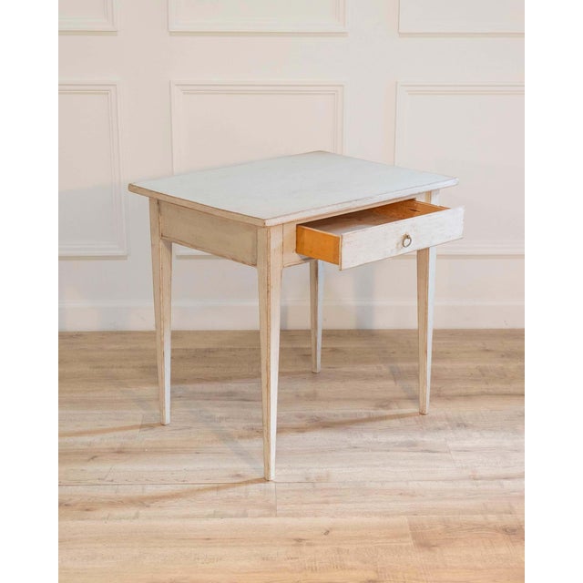 A charming 19th-century Swedish desk, crafted in pine and finished in a light, softly aged painted surface typical of...