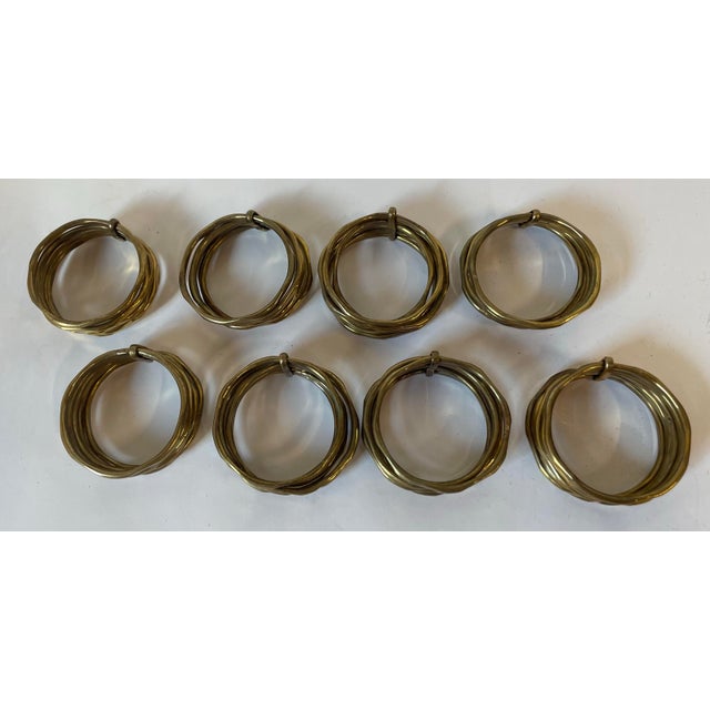 Nice vintage brass napkin rings consisting of six individual rings per napkin ring.