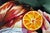 Abstract Perception in Orange by Ale Casanova | Oil on linen Woman with blindfold holding an orange slice. For Sale - Image 3 of 3