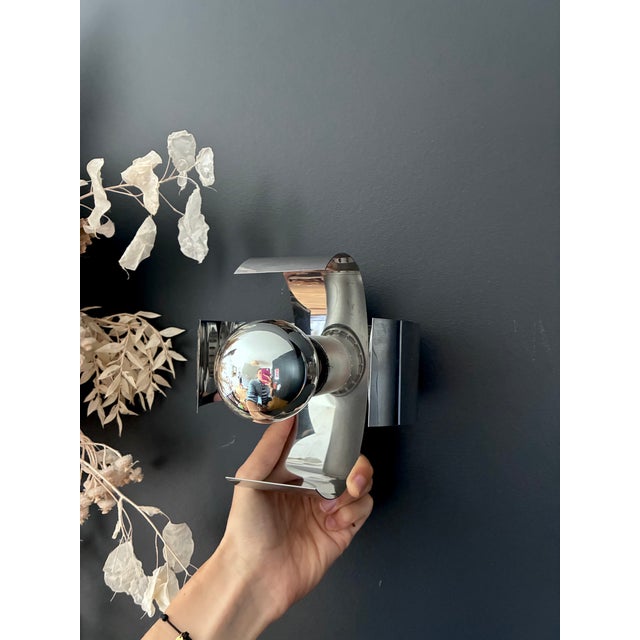 Chrome-plated metal wall sconces composed of four cruciform shades. 1960s. In excellent condition. Electrical connection...