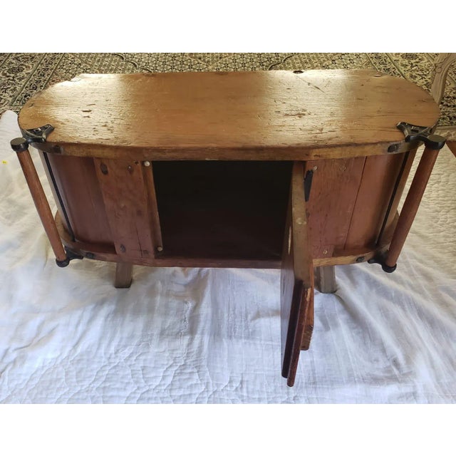 Antique Butter Churn Table Cabinet with center door that opens for storage. One door in front. Handle on each side of...