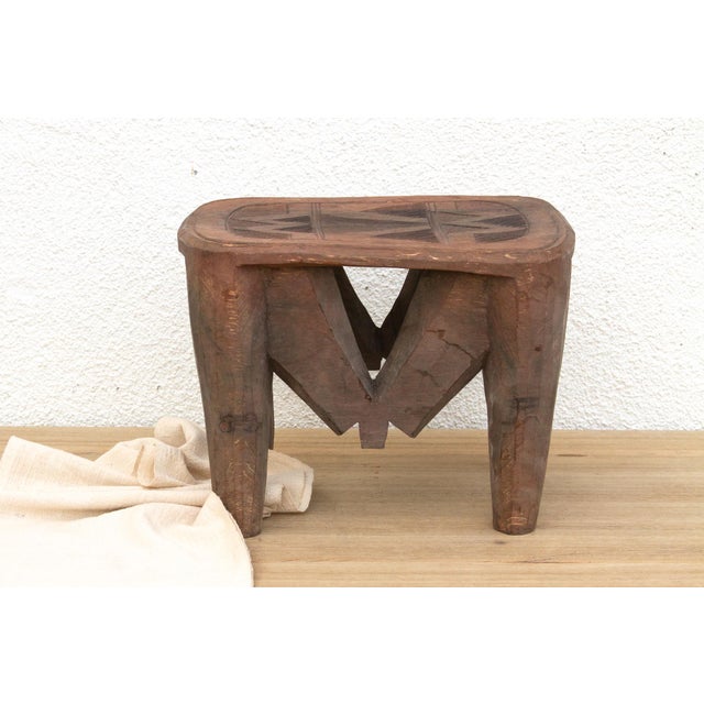 A unique piece of African art, this vintage Nupe table from Nigeria is a must-have for collectors and enthusiasts of Nupe...