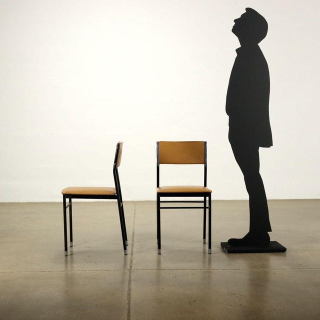 Group of 4 chairs, expanded padding, skai coating, enameled metal with chromed tips. Group of chairs that lend themselves...