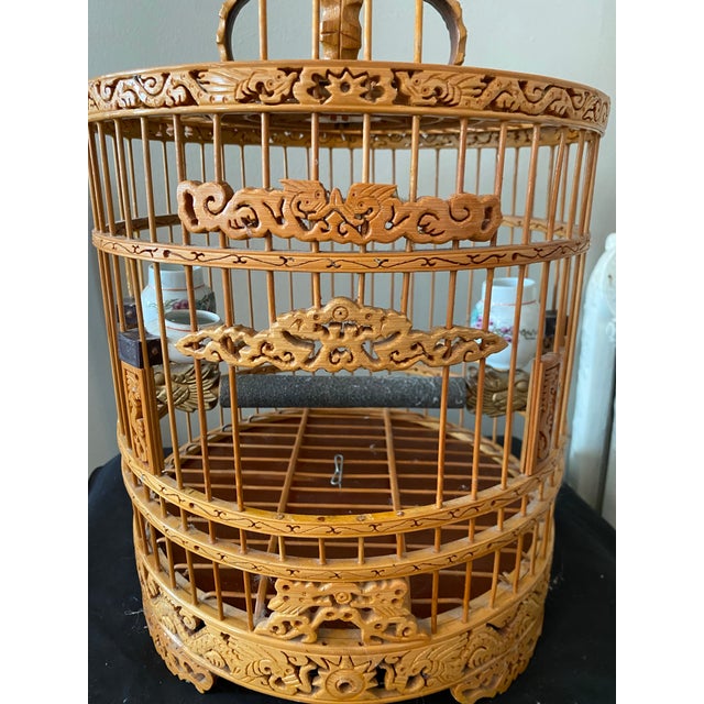 This vintage Chinese bamboo bird cage is a beautiful addition to any lucky bird or any home collection. The cage features...