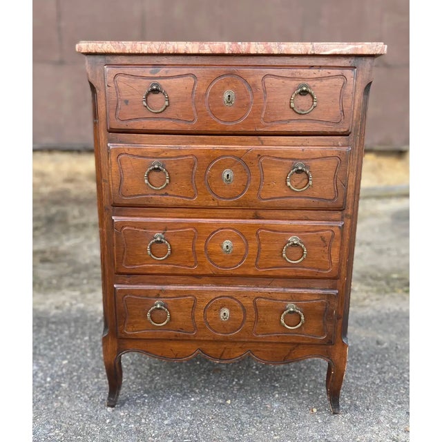 Great little 19th-century French marble-top chest with canted corners, a shaped marble top, and French feet. Great height...