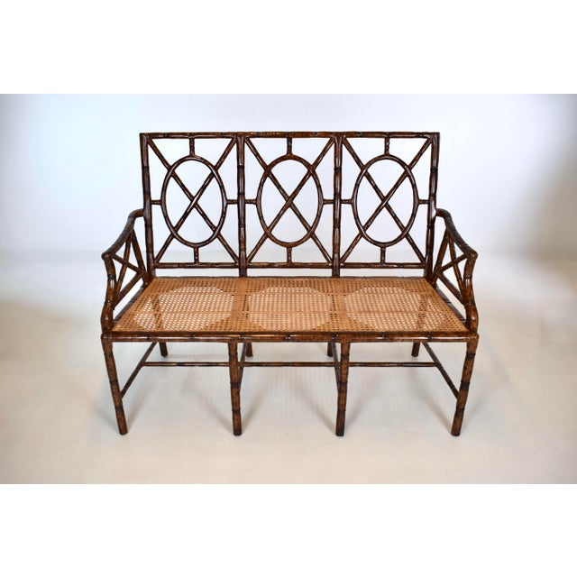 Faux bamboo bench settee with Tortoise shell lacquered finish, beautifully caned seat and custom leather down filled seat...