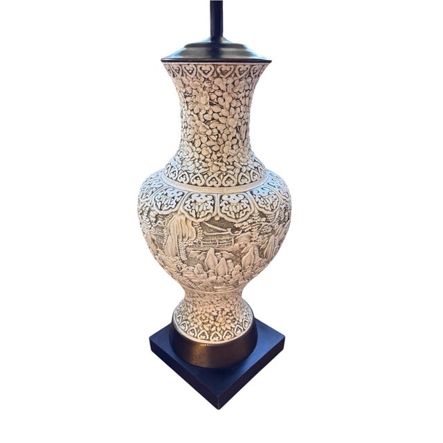 Dramatic vintage Asian-inspired table lamp featuring an elaborately detailed urn-form body worked in deep relief with an...