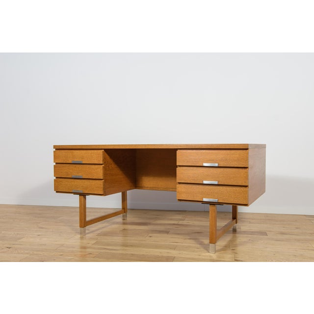 This desk was made in the 1970s by the renowned Danish manufacturer Eigil Petersens Møbelfabrik. Crafted from oak. The...