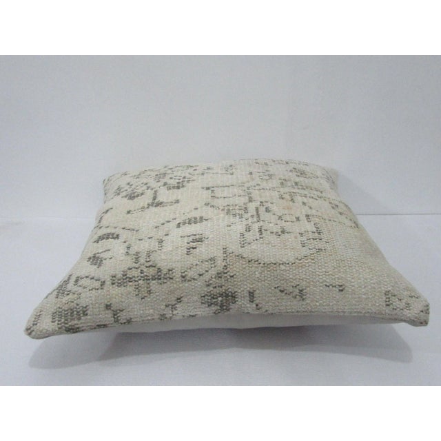 Decorative pillow cover made from a vintage Turkish handknotted rug. Backed with good quality cotton fabric. Pillow...