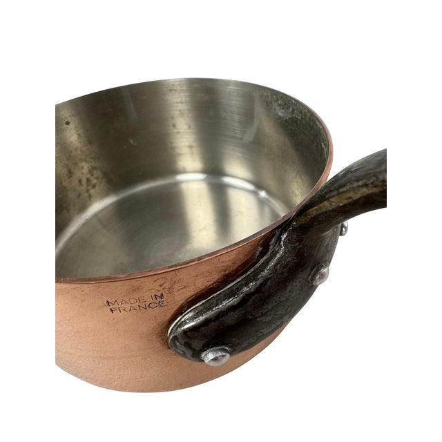 A set of 5 graduated copper saucepans with iron handles. A beautiful set of 5 vintage copper saucepans, a must for your...