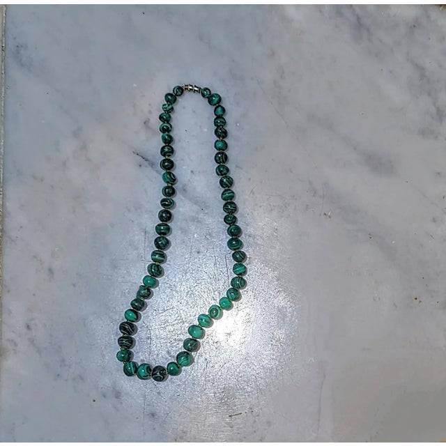 This is part of Chairish’s Costume Jewelry assortment. Graduated Malachite beaded 21". Purchased in the 70's from the...