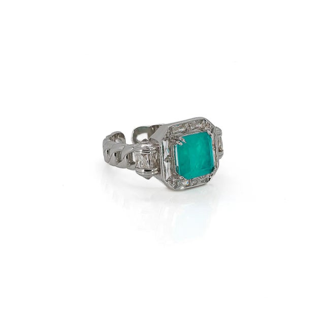The Paraiba Tourmaline Happy Cocktail Ring is a celebration of opulence and individuality. It's fusion of sterling silver,...