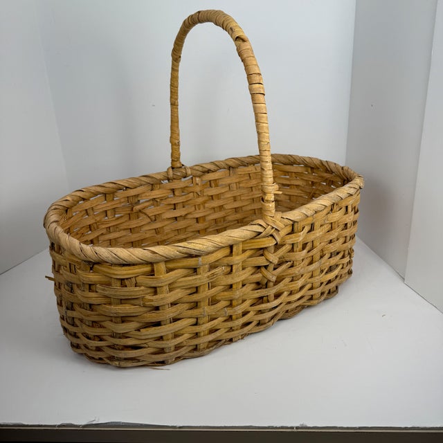 This is a split wood gathering basket, likely dating from the 19th or early 20th century, historically used for harvesting...