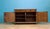 Early 20th century continental oak sideboard with carved detailing, pierced panel doors and turned bun feet. Fitted with...