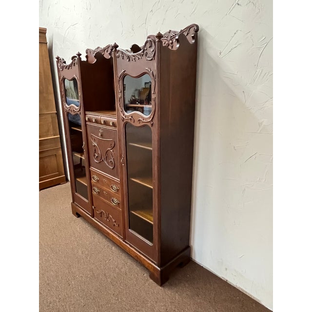 This is a very nice Victorian Oak Side by Side Secretary Desk, circa 1895 in good original finish. The left side has a...
