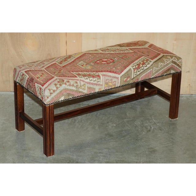 Victorian style George Smith mahogany footstool with super collectable Kilim upholstery and reeded legs. A very good...