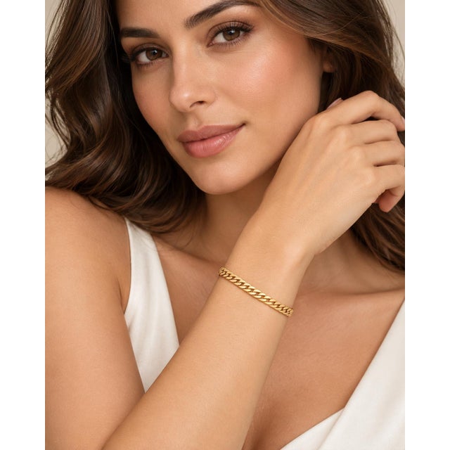 An authentic and sleek vintage bracelet crafted in radiant solid 14k yellow gold. Featuring a fluid, flat snake chain...