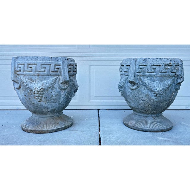 Pair of Antique Greek Key Grape Motif Garden Urns/ Planters, Dating to Circa 1920 A striking pair of antique garden urns,...