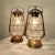 A pair of Italian lamps in the design of hurricane lanterns. The lamps are possible to use on the table or are hung from...