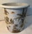 Beautiful porcelain cachepot jardiniere in a whimsical chinoiserie design with a vibrant, multi-tonal wrap-around scene of...