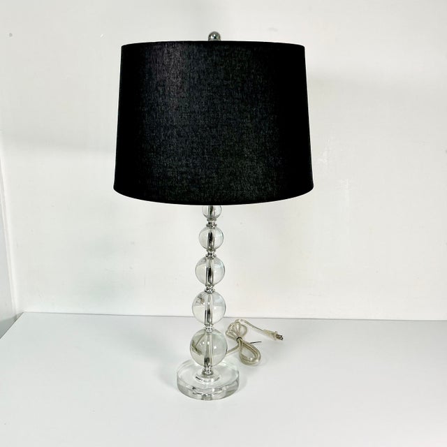 The 1970s and 80s showcased the beauty of Lucite in home furniture and decor. This is a stacking Round Balls Table Lamp...