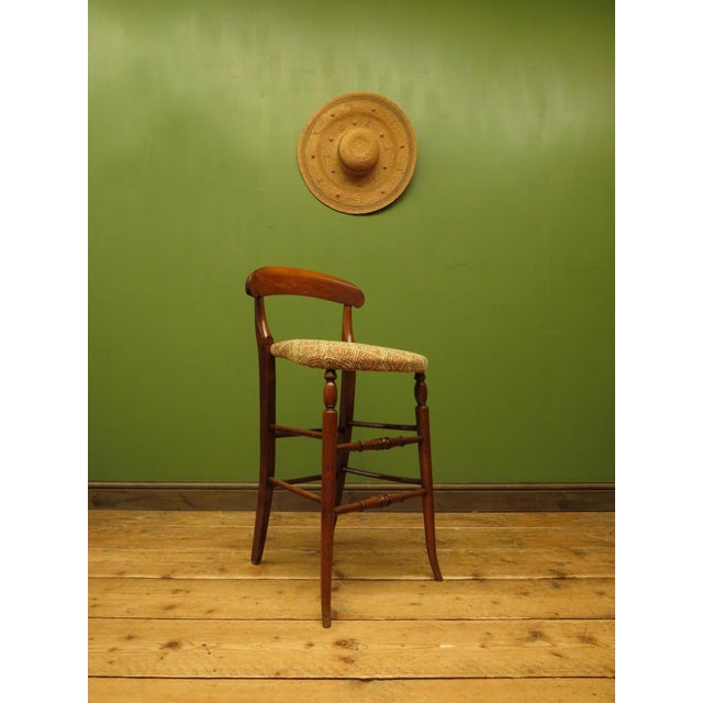 This is an antique cello stool dating to the early 20th century. The stool is made of stained Beech wood and is very...