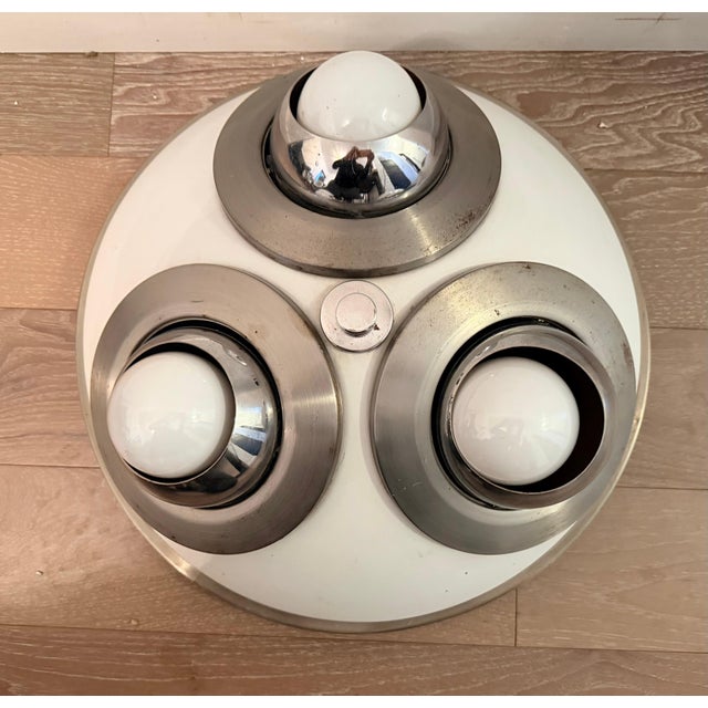 An original 1950s iconic italian Mid Century 3 socket directional flush ceiling light by the famed Italian maker,...
