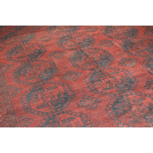 Vintage Turkoman tribal hand knotted rug with natural colors, elephant feet design and fine weave.