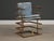 A solid oak and gold accent dining chair or lounge chair with original blue fabric. Circa 1980’s. Seat height is 20.5”....