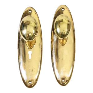 Late 20th Century Polished Brass Door Knob Set With Oval Plates - 4 Piece Set